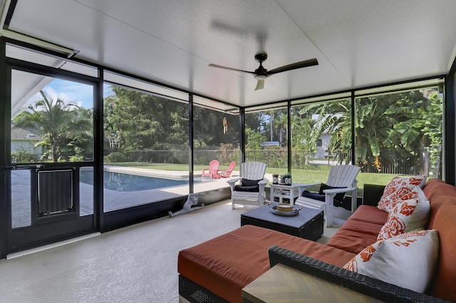 sunroom featuring ceiling fan