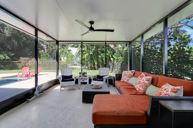 sunroom featuring ceiling fan