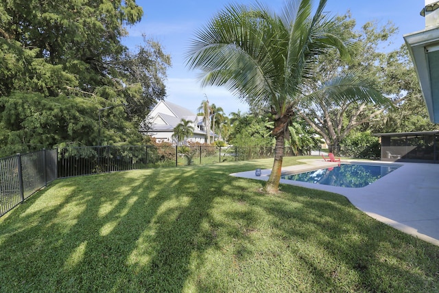 view of yard with a fenced in pool and a patio area