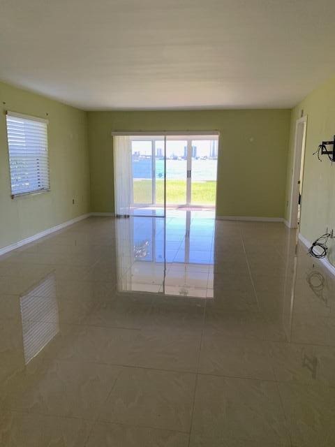 unfurnished room with tile patterned floors