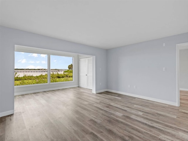 empty room with light wood-type flooring