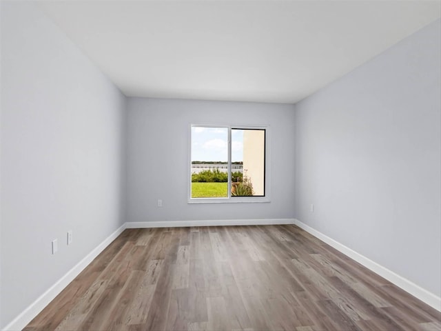 unfurnished room with light hardwood / wood-style floors