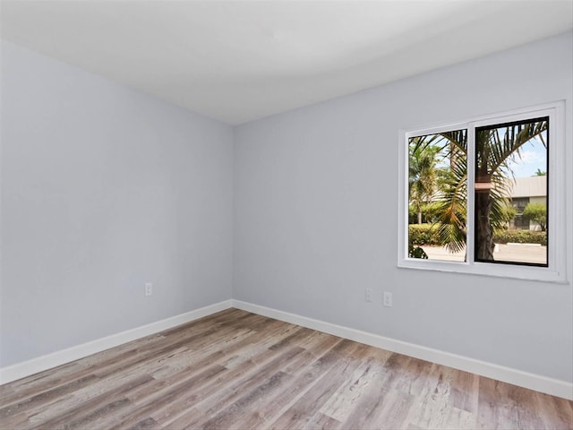 spare room with light hardwood / wood-style flooring