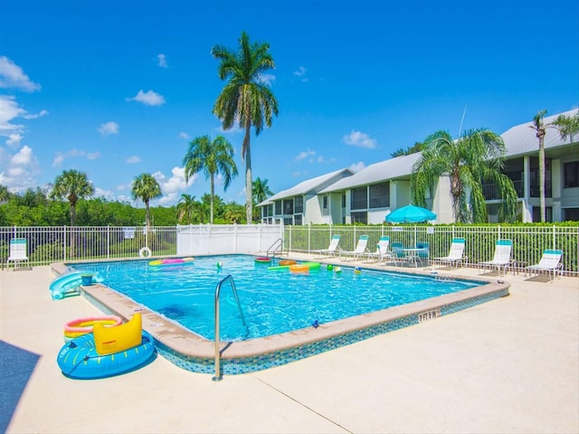 view of swimming pool with a patio