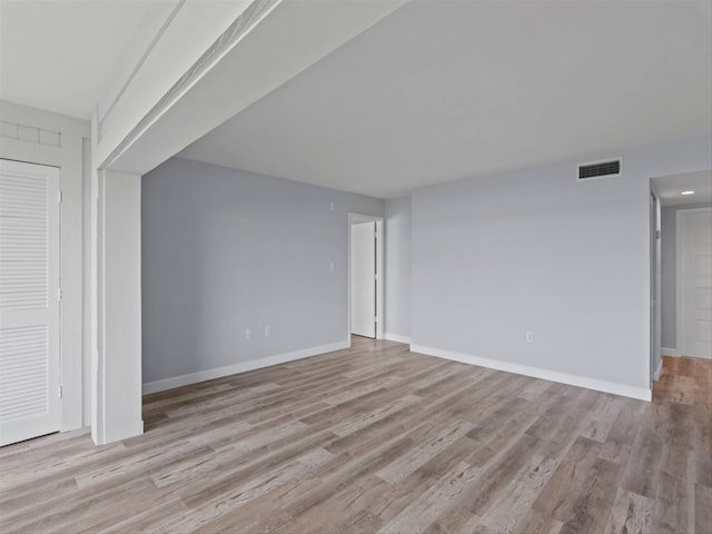 unfurnished room with light hardwood / wood-style floors