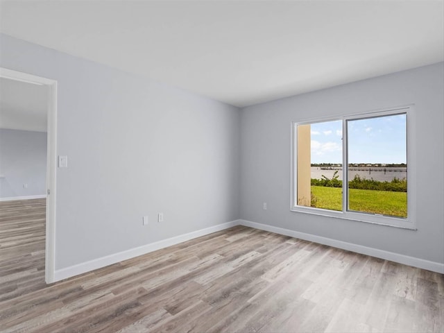 spare room with light hardwood / wood-style floors