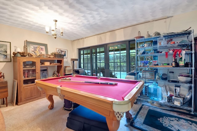 game room with french doors, carpet floors, billiards, and a chandelier