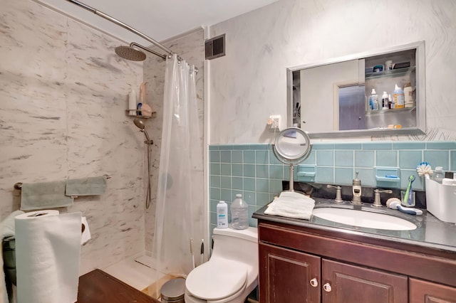 bathroom with walk in shower, tile walls, vanity, and toilet