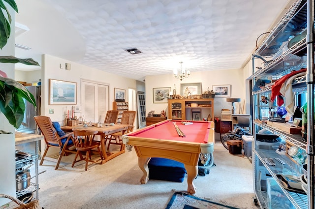 recreation room with light carpet, a chandelier, and billiards