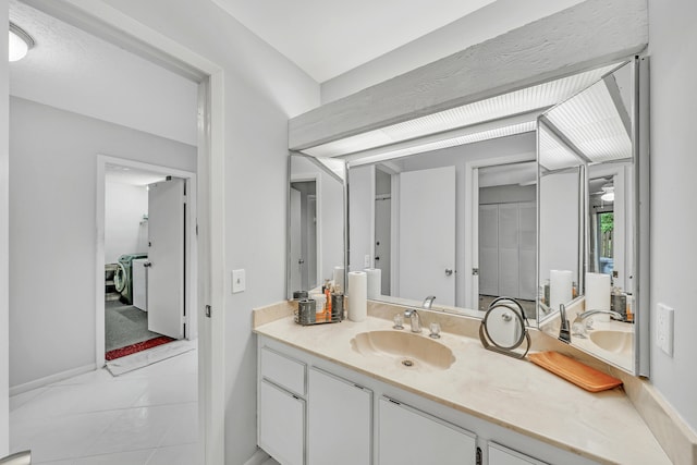 bathroom featuring tile patterned floors and vanity