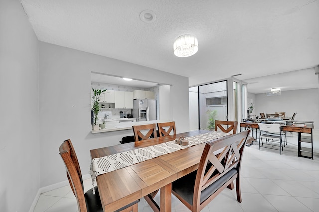 dining space with a textured ceiling