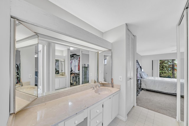 bathroom featuring tile patterned flooring and vanity