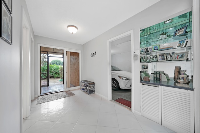 foyer featuring light tile patterned floors