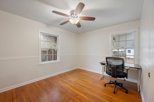 office space with ceiling fan and hardwood / wood-style flooring