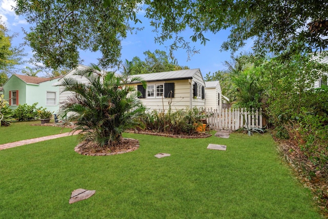 view of front of home with a front yard