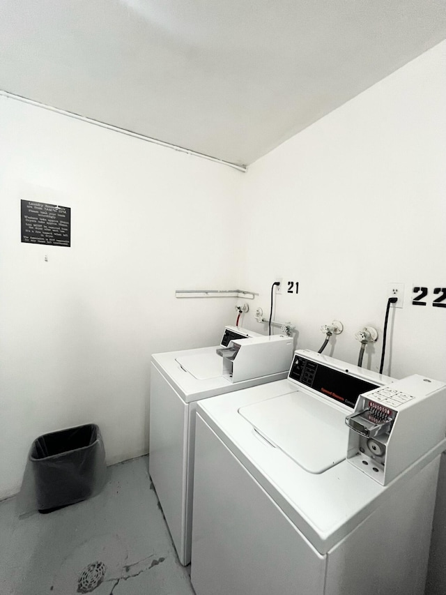 clothes washing area featuring independent washer and dryer