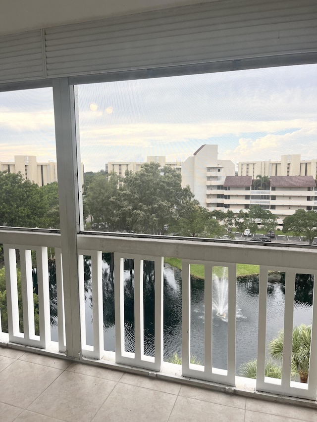 balcony featuring a water view