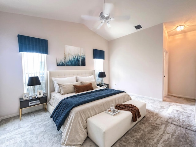 carpeted bedroom with vaulted ceiling and ceiling fan