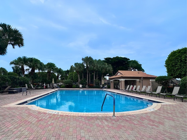 view of swimming pool featuring a patio area