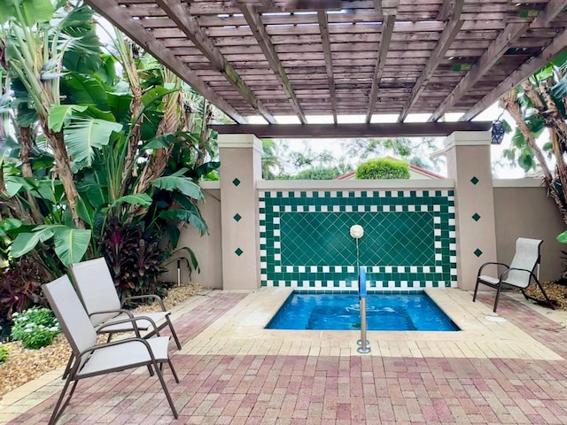 view of swimming pool with a jacuzzi, a pergola, and a patio area