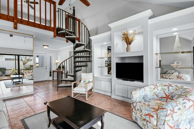 tiled living room featuring built in shelves, ceiling fan, crown molding, and high vaulted ceiling