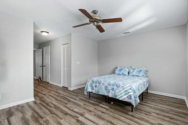 bedroom featuring hardwood / wood-style floors and ceiling fan