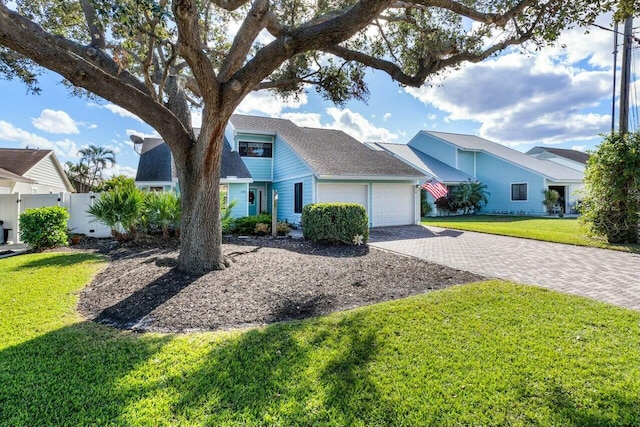 ranch-style home featuring a front yard and a garage