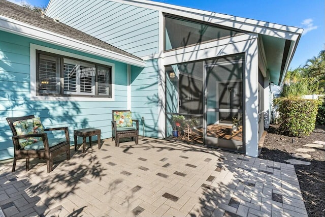 view of patio with a sunroom