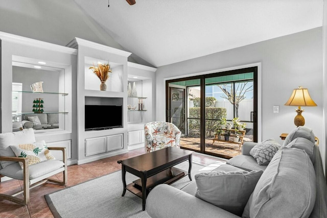 tiled living room with built in features, ceiling fan, and lofted ceiling