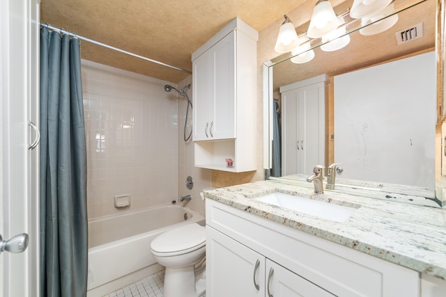 full bathroom featuring a textured ceiling, tile patterned floors, shower / bath combo with shower curtain, vanity, and toilet