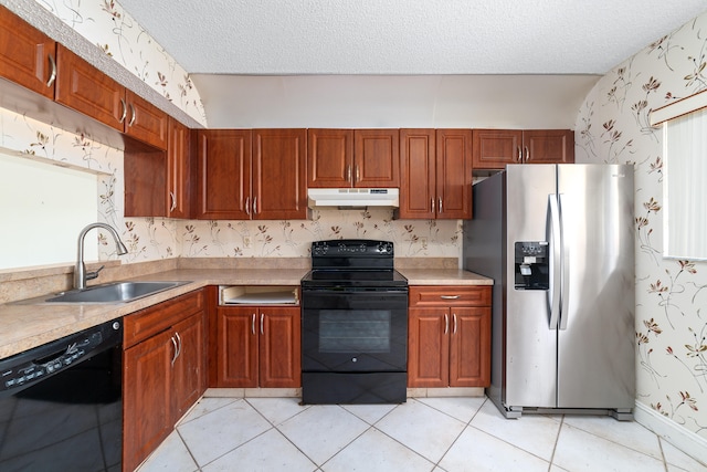 kitchen featuring black appliances, a textured ceiling, light tile patterned flooring, and sink