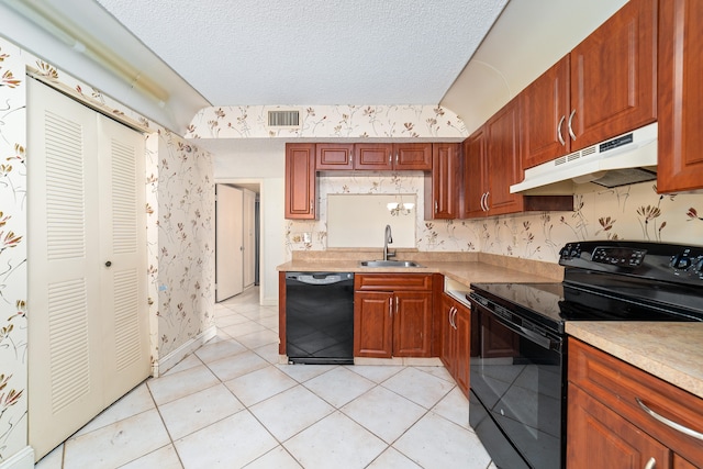 kitchen with black appliances, a textured ceiling, light tile patterned floors, and sink