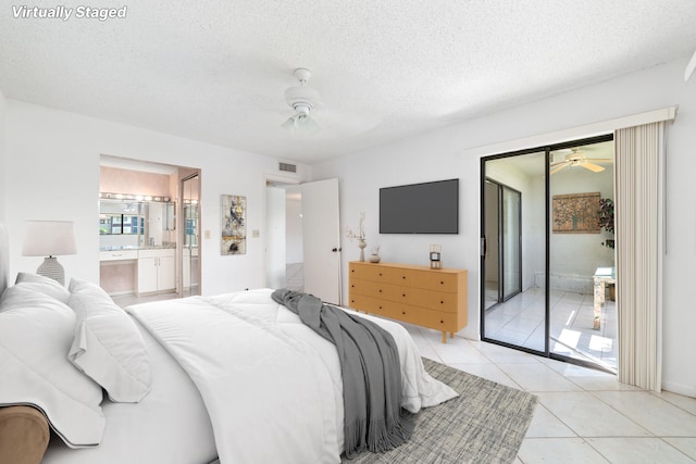 bedroom with ceiling fan, light tile patterned floors, a textured ceiling, and access to exterior