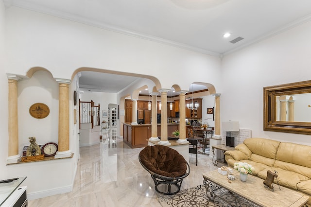 living room featuring an inviting chandelier and crown molding