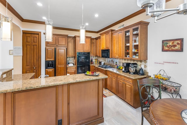 kitchen featuring light stone countertops, kitchen peninsula, pendant lighting, a breakfast bar, and black appliances