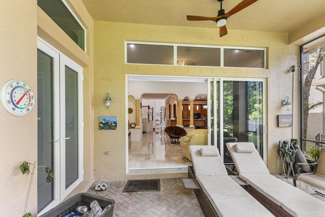 view of patio with ceiling fan and french doors