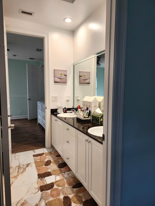 bathroom featuring vanity and wood-type flooring