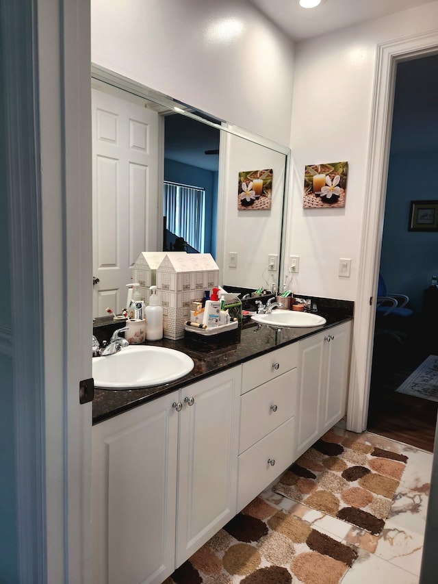 bathroom with vanity and wood-type flooring