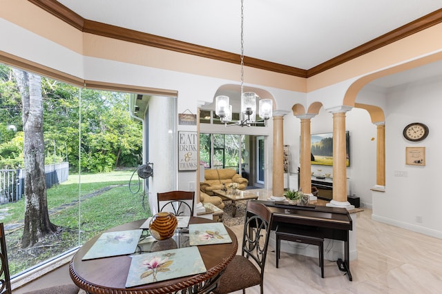 dining area featuring ornate columns, crown molding, a wealth of natural light, and an inviting chandelier