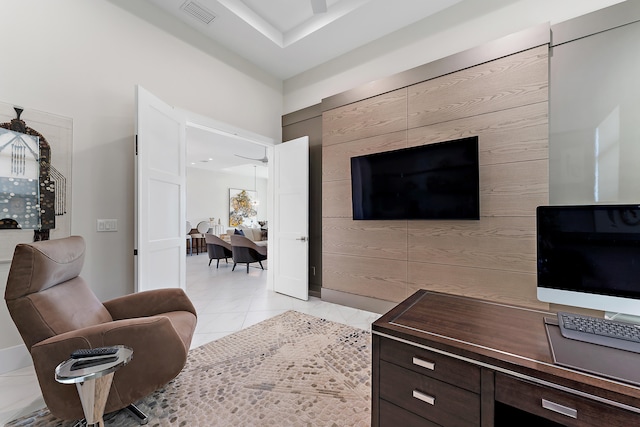 tiled living room featuring wooden walls