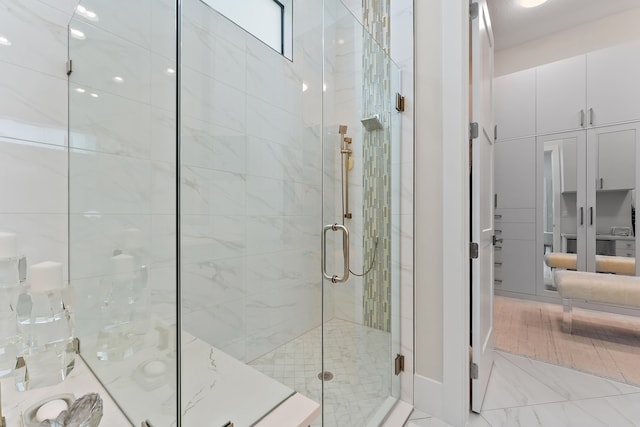 bathroom featuring an enclosed shower