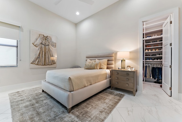 bedroom with ceiling fan and a closet