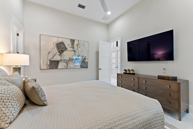 bedroom featuring tile patterned flooring and ceiling fan