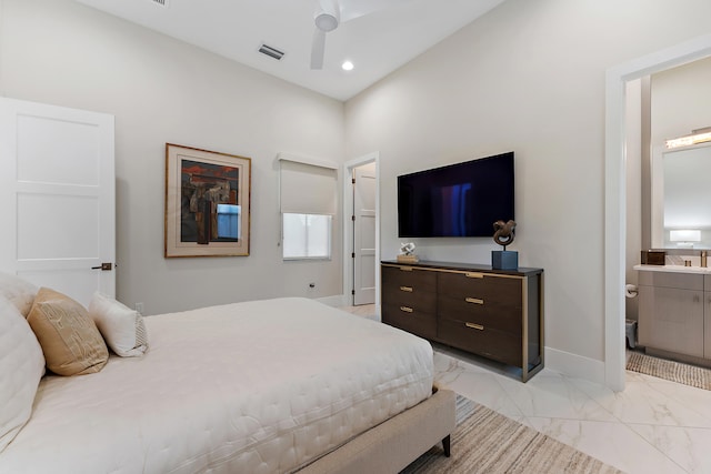 bedroom with ceiling fan and connected bathroom