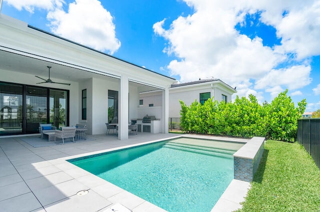 view of swimming pool with a patio and ceiling fan