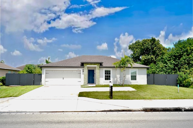 view of front of property featuring a garage and a front lawn