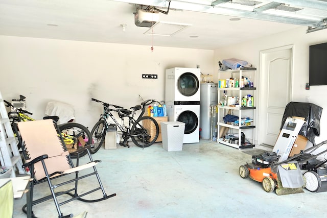 garage with stacked washer / dryer, a garage door opener, and water heater