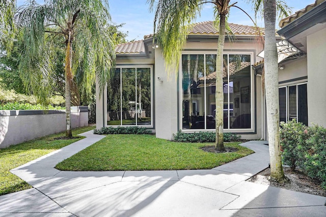 6595 NW 32nd Ter, Boca Raton, FL 33496 - rear view of property with stucco siding and a tiled roof