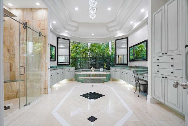6595 NW 32nd Ter, Boca Raton, FL 33496 - bathroom with inlaid floor details, vanity, a garden tub, a tray ceiling, and crown molding