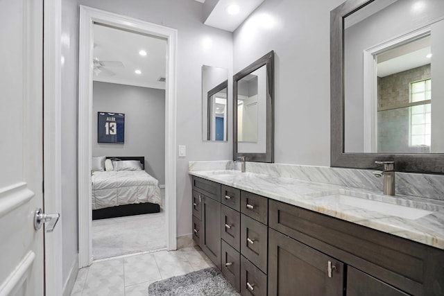 6595 NW 32nd Ter, Boca Raton, FL 33496 - full bathroom with double vanity, a ceiling fan, connected bathroom, baseboards, and ornamental molding